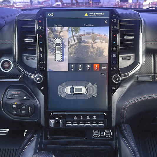 Car dashboard with a large touchscreen displaying camera views